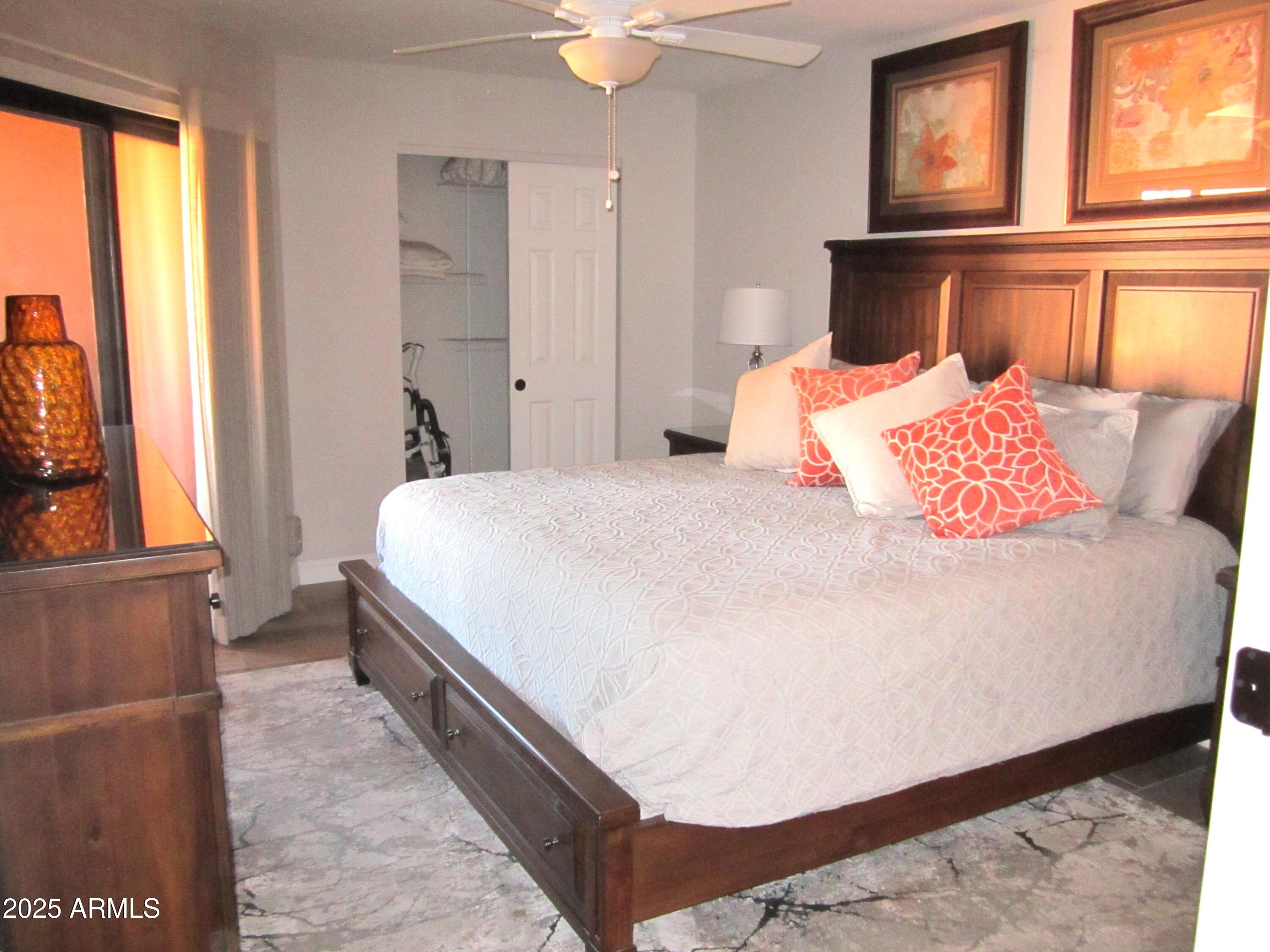 4303 East Cactus Road, Unit 407 Phoenix, AZ 85032 - Photo 6 of 16 a bedroom with a bed and a window