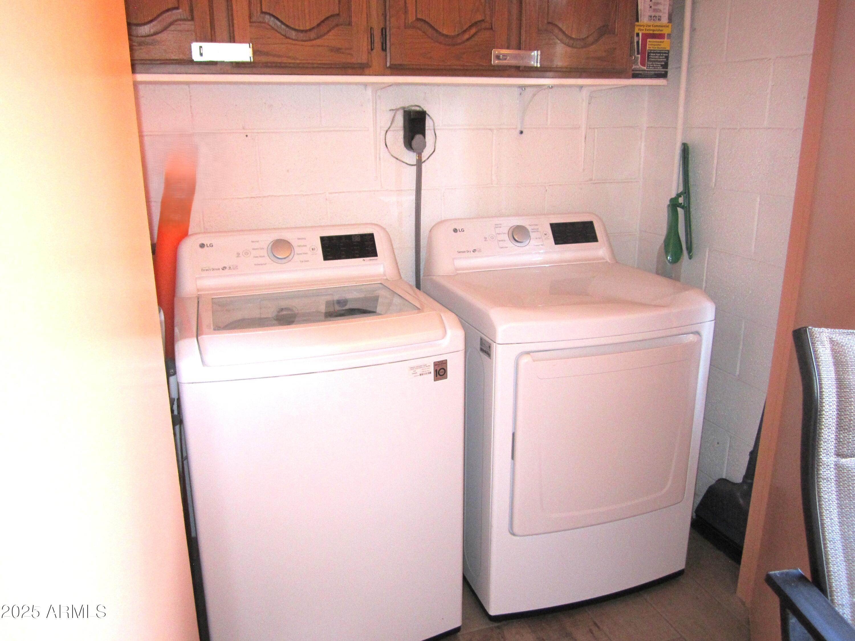 4303 East Cactus Road, Unit 407 Phoenix, AZ 85032 - Photo 10 of 16 a utility room with dryer and washer