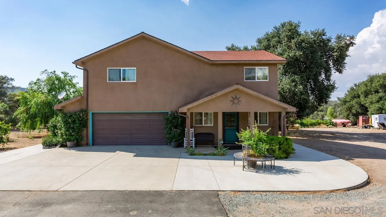 2341 Lake Morena Drive Campo, CA 91906 - Photo 21 of 45 a front view of a house with a garden