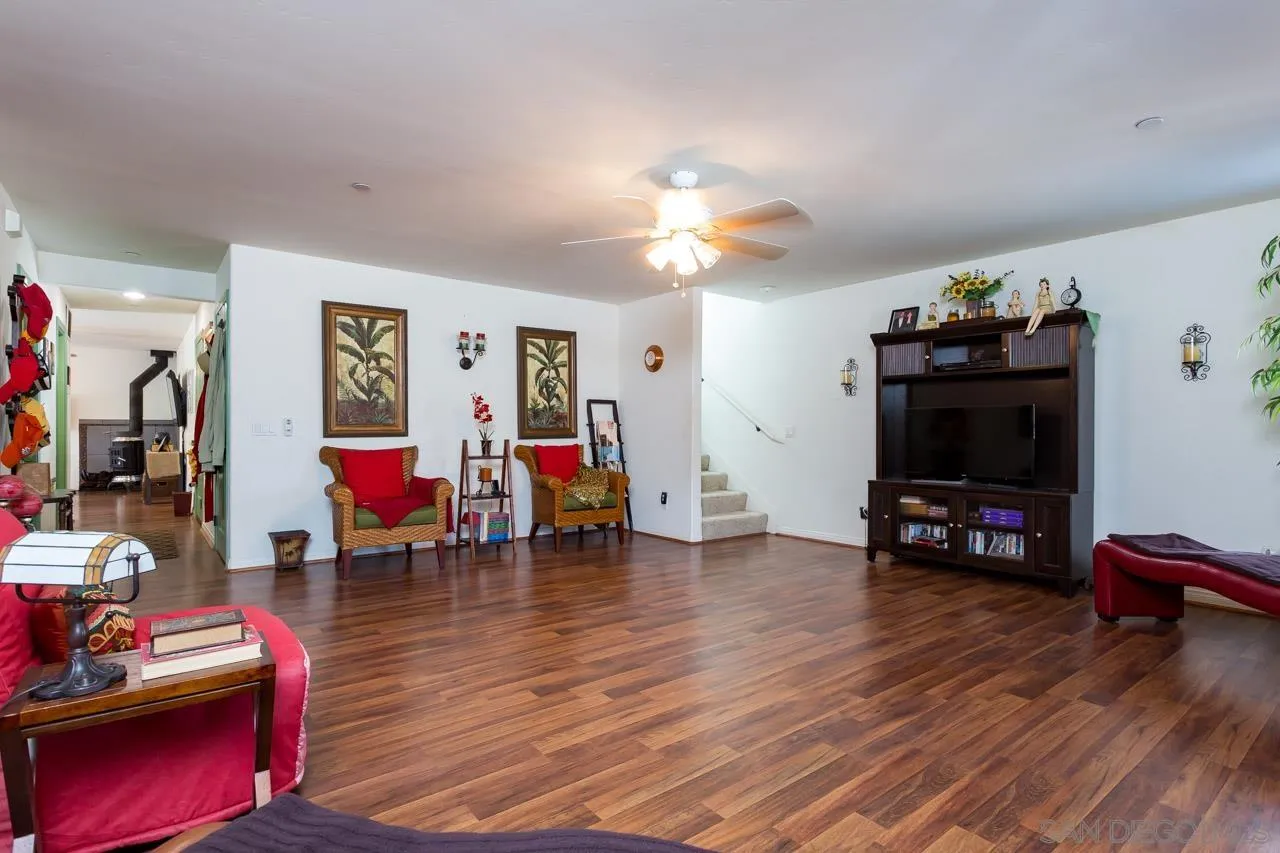 2341 Lake Morena Drive Campo, CA 91906 - Photo 23 of 45 a living room with furniture and a flat screen tv