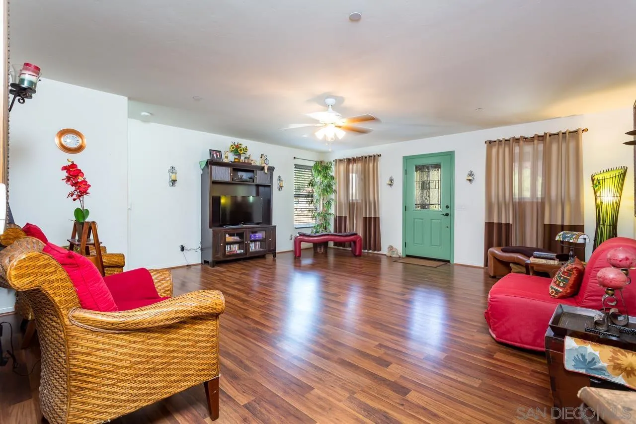 2341 Lake Morena Drive Campo, CA 91906 - Photo 24 of 45 a living room with furniture and a flat screen tv