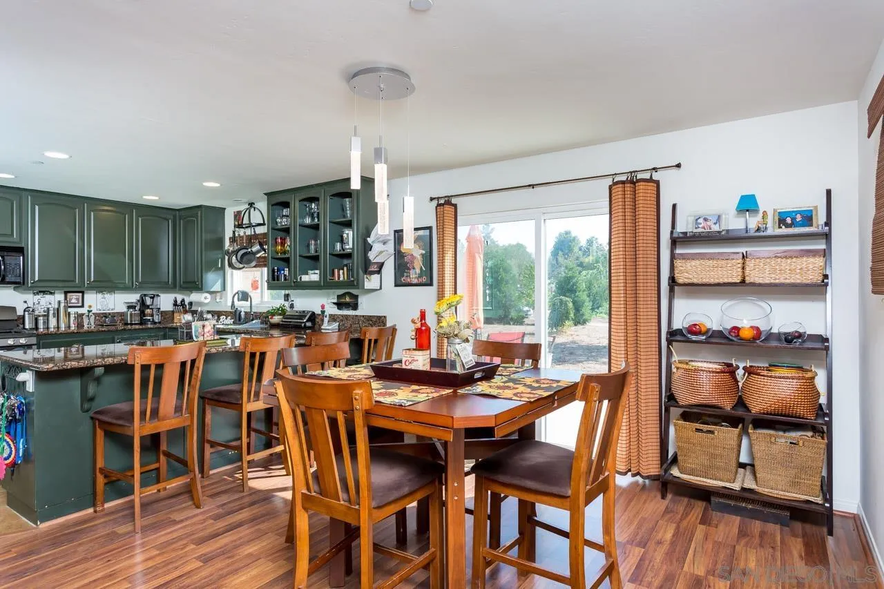 2341 Lake Morena Drive Campo, CA 91906 - Photo 32 of 45 a dining room with furniture and wooden floor