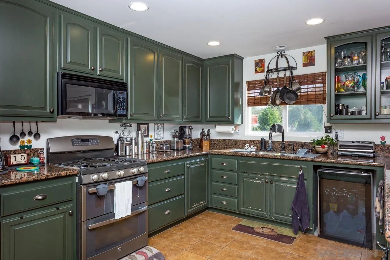 2341 Lake Morena Drive Campo, CA 91906 - Photo 37 of 45 a kitchen with lots of counter top space and cabinets