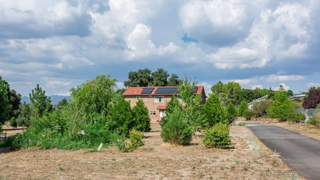2341 Lake Morena Drive Campo, CA 91906 - Photo 9 of 45 a view of a pathway with a yard in front of it