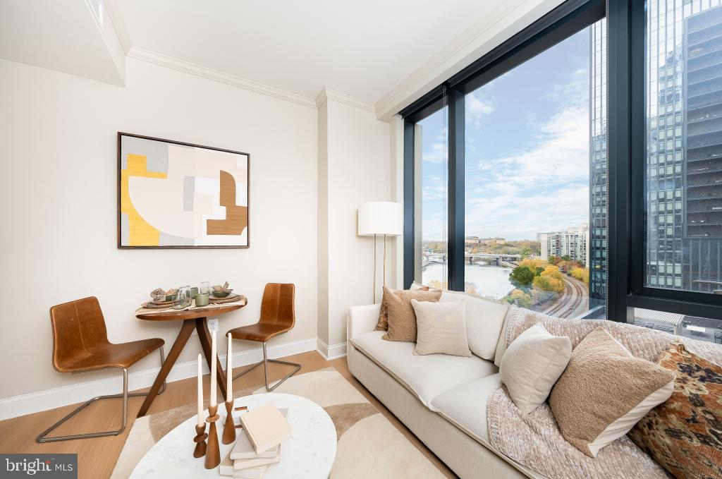 2301-61 John F Kennedy Boulevard, Unit 507 Philadelphia, PA 19103 - Photo 24 of 39 a living room with furniture and a large window