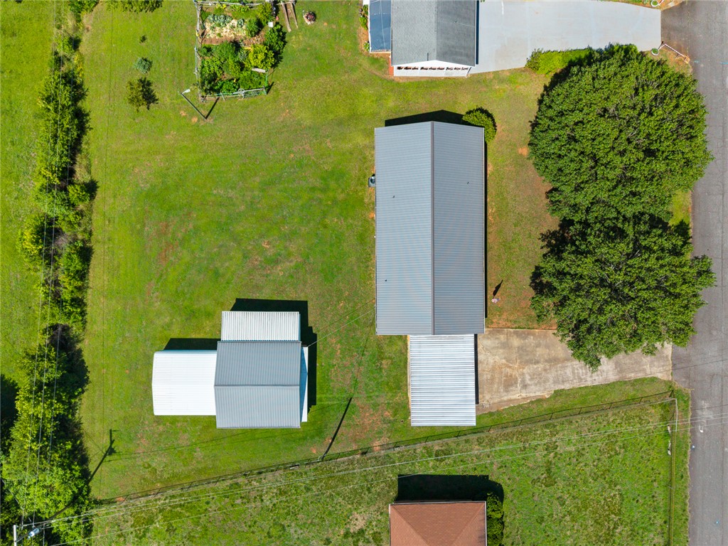 312 Edwards Drive Anderson, SC 29626 - Photo 43 of 44 Aerial view showcasing multiple outbuildings and green grounds, perfect for varied uses.