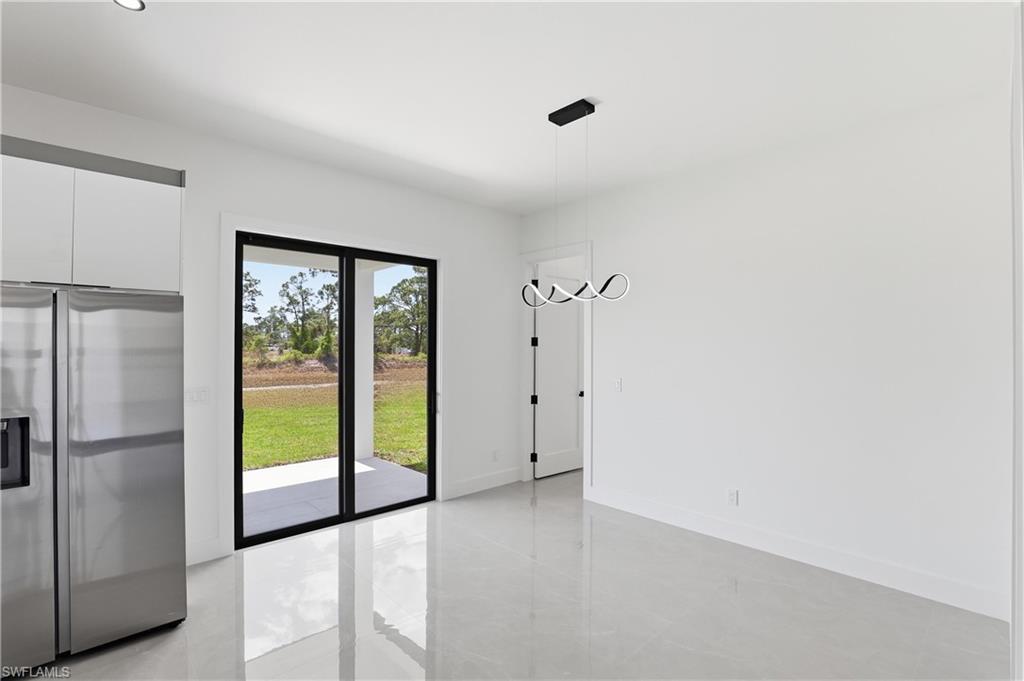 1122 Edelweiss Street East Lehigh Acres, FL 33974 - Photo 13 of 27 a view of an empty room with a window