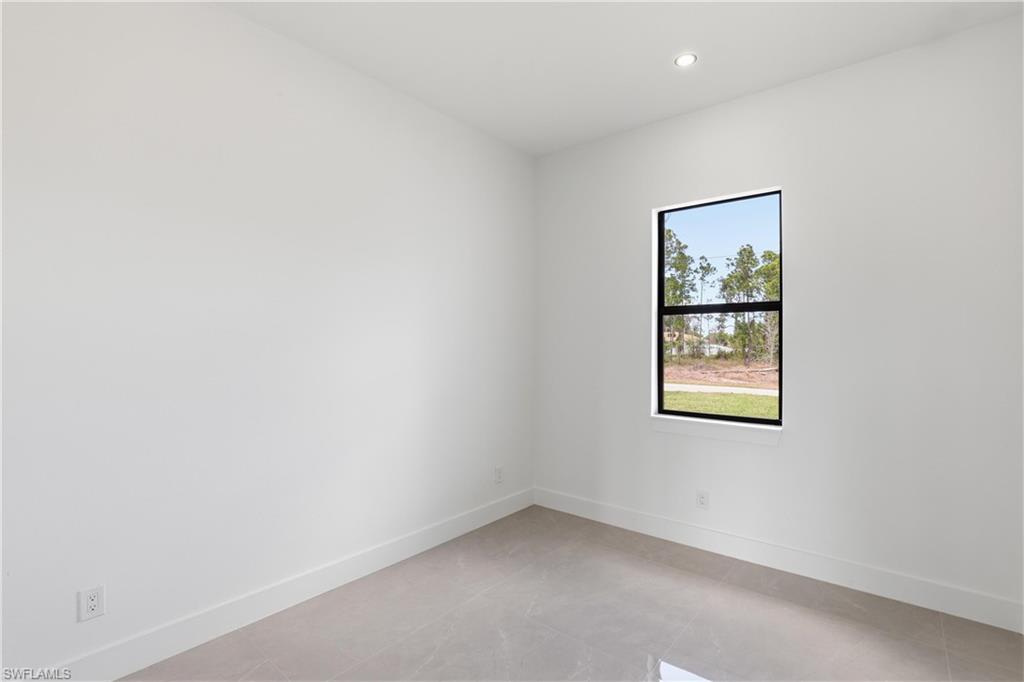1122 Edelweiss Street East Lehigh Acres, FL 33974 - Photo 20 of 27 an empty room with a window