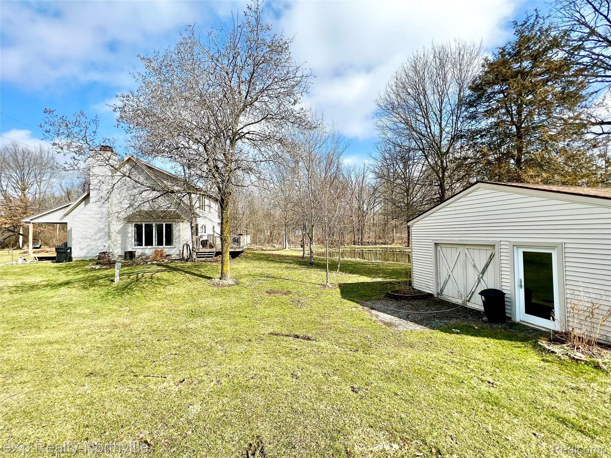 6573 Pinckney Road Pinckney, MI 48169 - Photo 15 of 20 Garage and Side Yard