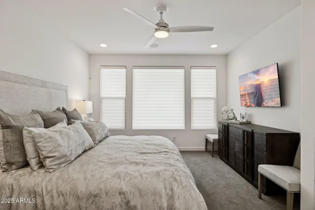 a view of a workspace with furniture and wooden floor
