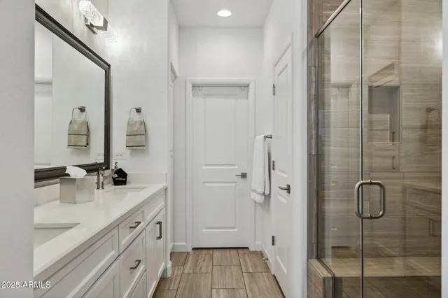 a living room with patio furniture and a floor to ceiling window