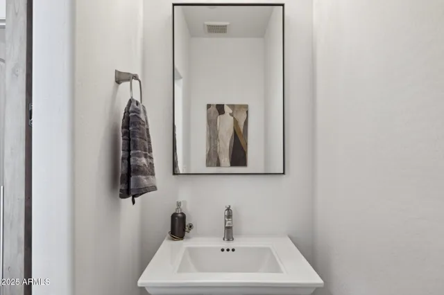 a view of a house with swimming pool and sitting area