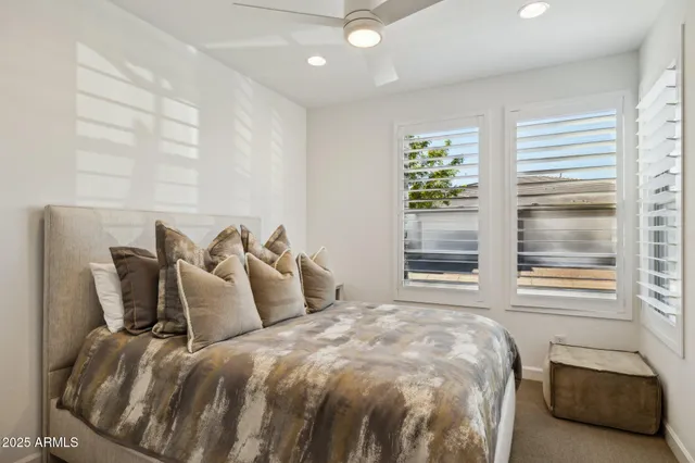 a view of a house with potted plants in front of door