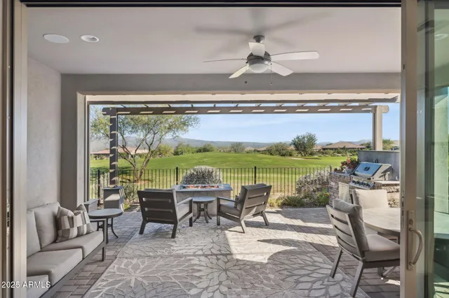 an aerial view of a house with outdoor space