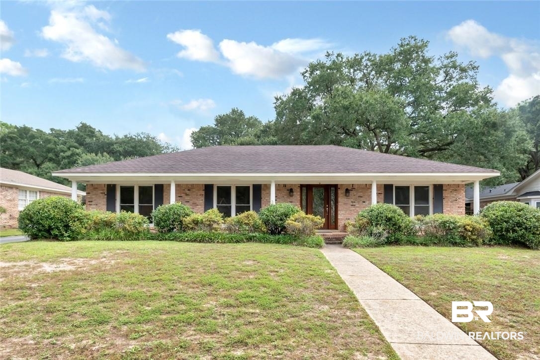 6109 Timberly Road North Mobile, AL 36609 - Photo 1 of 26 Ranch-style home with covered porch and a front yard