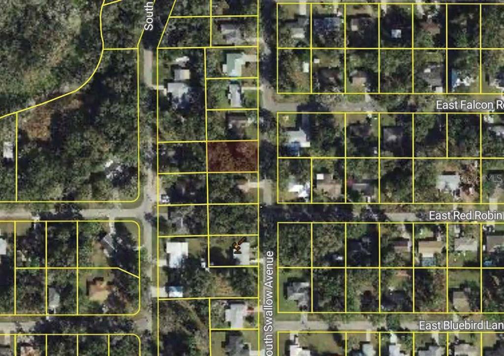 5136 South Swallow Avenue Inverness, FL 34452 - Photo 2 of 2 a view of a wooden deck with a large window