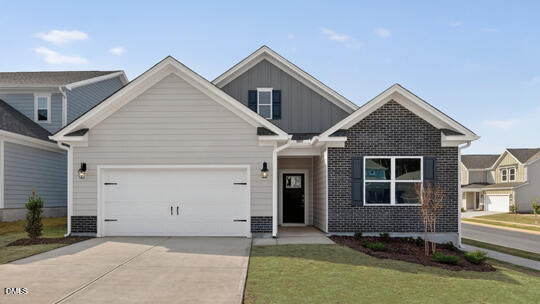 7580 Percussion Drive Apex, NC 27539 - Photo 1 of 44 a front view of a house with a yard