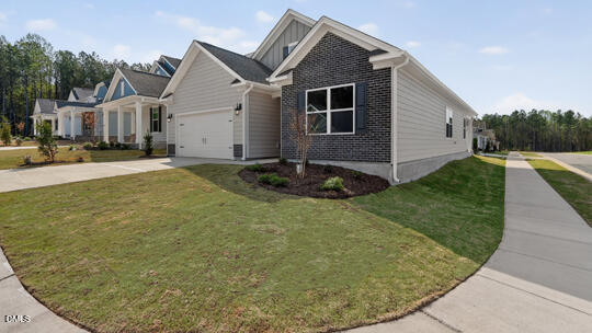 7580 Percussion Drive Apex, NC 27539 - Photo 2 of 44 a front view of a house with garden