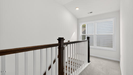 7580 Percussion Drive Apex, NC 27539 - Photo 23 of 44 a view of a hallway with windows