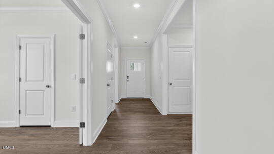 7580 Percussion Drive Apex, NC 27539 - Photo 3 of 44 a view of a hallway with wooden floor