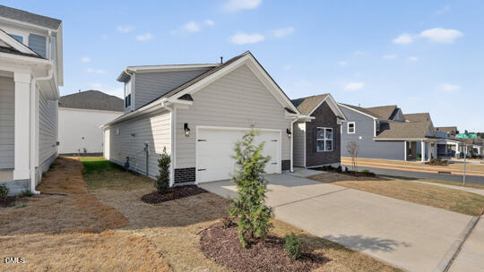 7580 Percussion Drive Apex, NC 27539 - Photo 40 of 44 a front view of a house with a yard