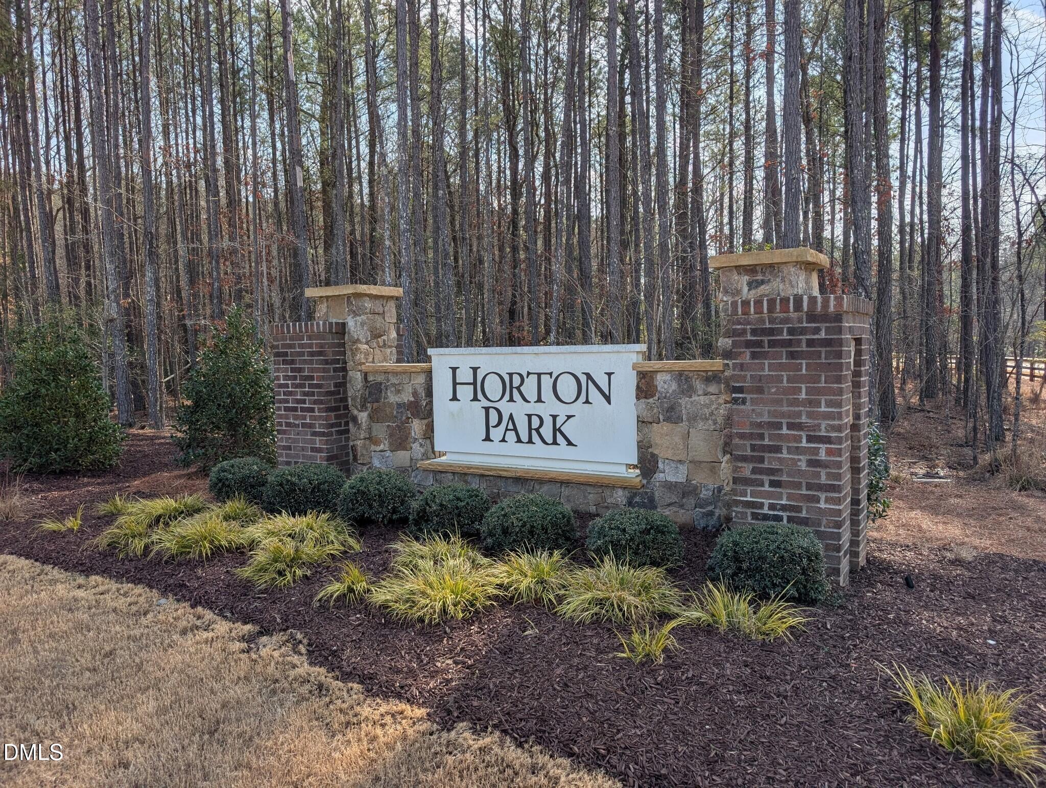 7580 Percussion Drive Apex, NC 27539 - Photo 44 of 44 a sign of golf club on a brick wall