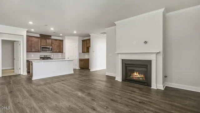 a view of kitchen with refrigerator stove microwave and cabinets