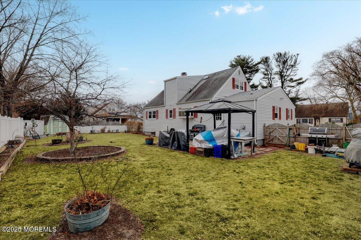 7 Rutgers Terrace Neptune Township, NJ 07753 - Photo 24 of 27 a view of a house with backyard patio and fire pit