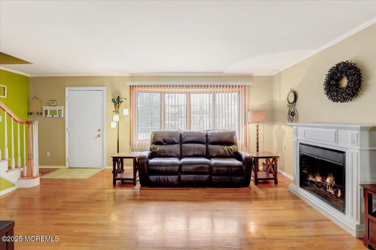 7 Rutgers Terrace Neptune Township, NJ 07753 - Photo 5 of 27 a living room with furniture window and a fireplace