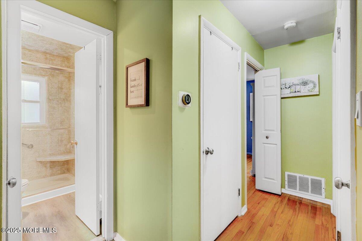 7 Rutgers Terrace Neptune Township, NJ 07753 - Photo 10 of 27 a view of a hallway with wooden floor and closet