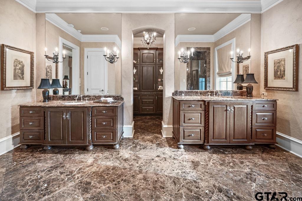 3048 Concord Place Tyler, TX 75701 - Photo 17 of 34 a spacious bathroom with a granite countertop sink and a mirror