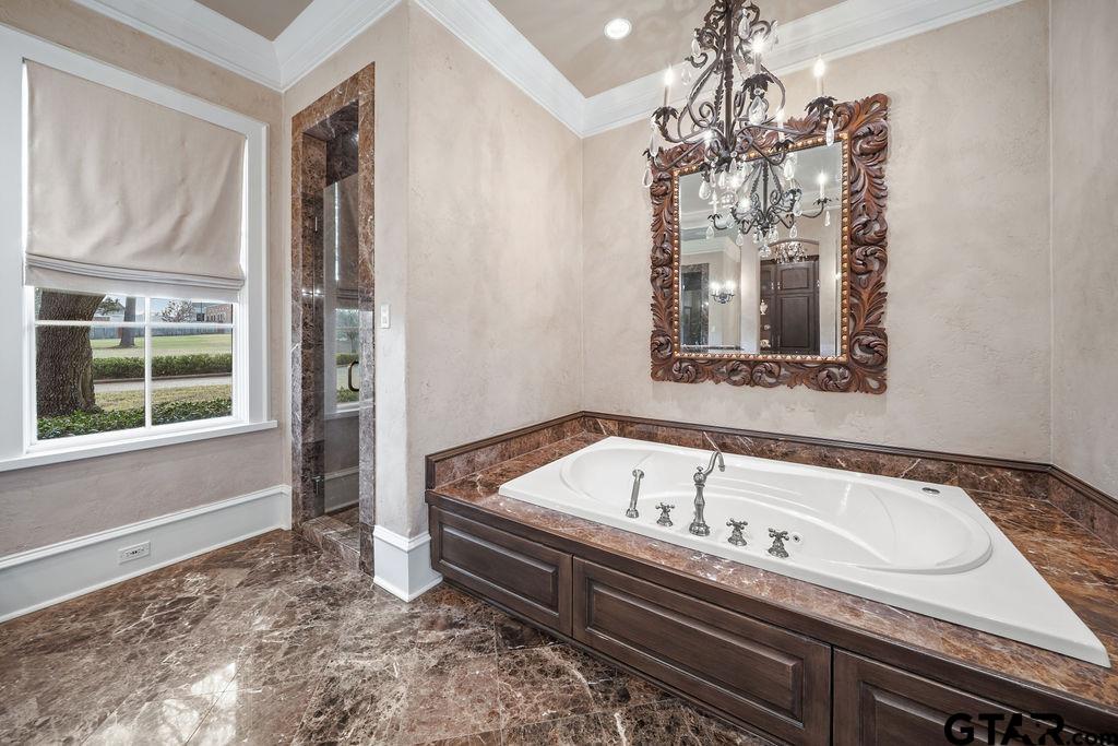 3048 Concord Place Tyler, TX 75701 - Photo 18 of 34 a bath tub sitting in a bathroom next to a window