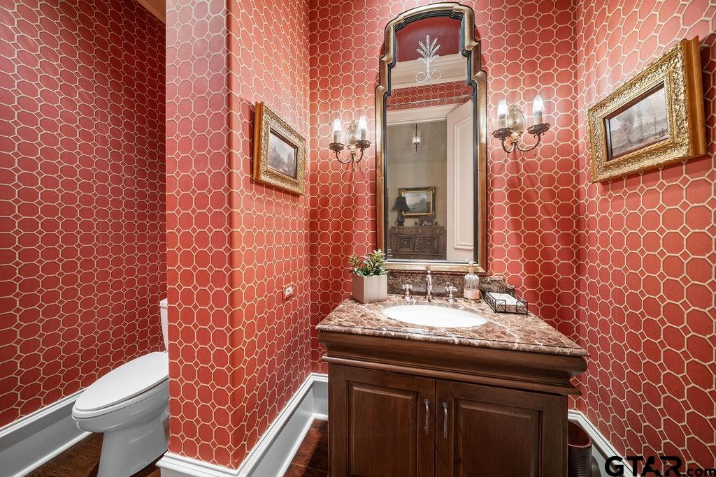 3048 Concord Place Tyler, TX 75701 - Photo 22 of 34 a bathroom with a granite countertop sink toilet and shower