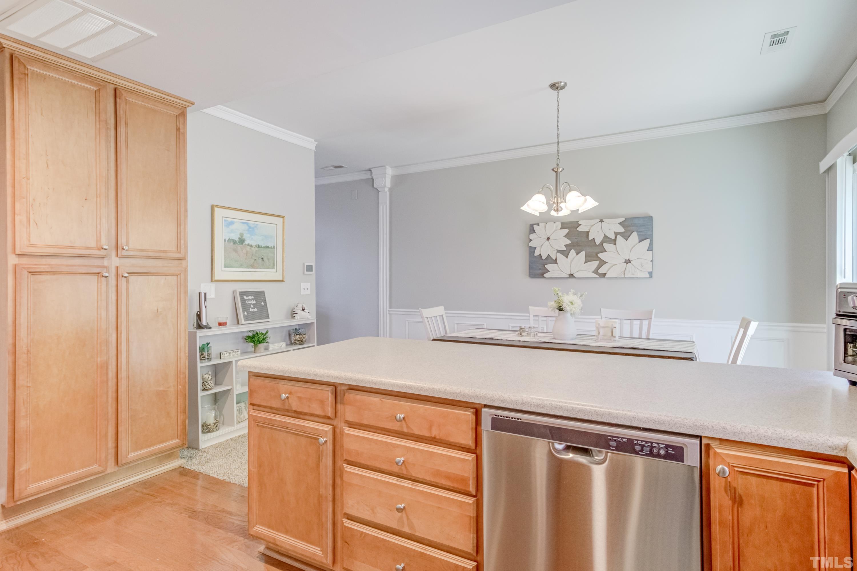 2101 Piney Brook Road, Unit 107 Raleigh, NC 27614 - Photo 19 of 37 a kitchen with a sink and cabinets