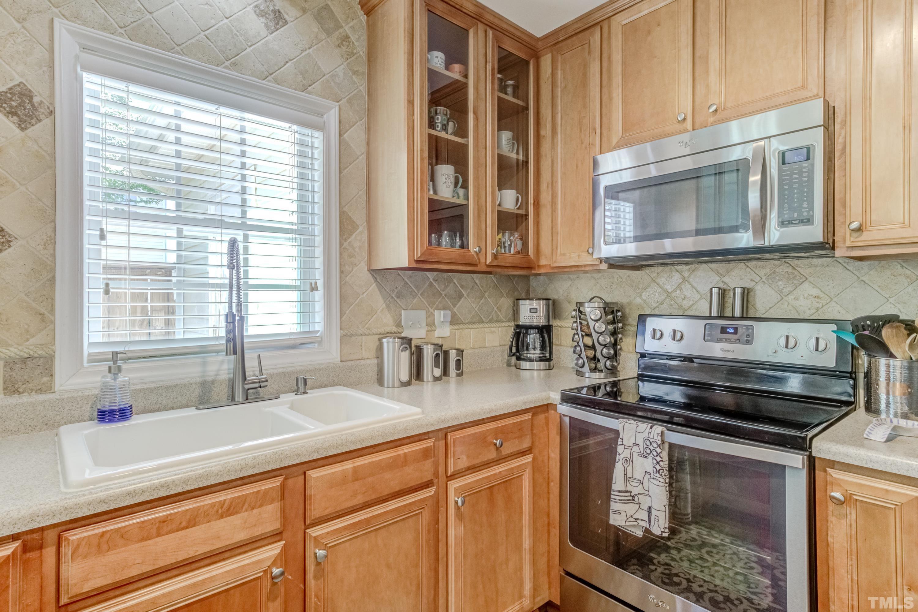 2101 Piney Brook Road, Unit 107 Raleigh, NC 27614 - Photo 20 of 37 a kitchen with a stove and a sink