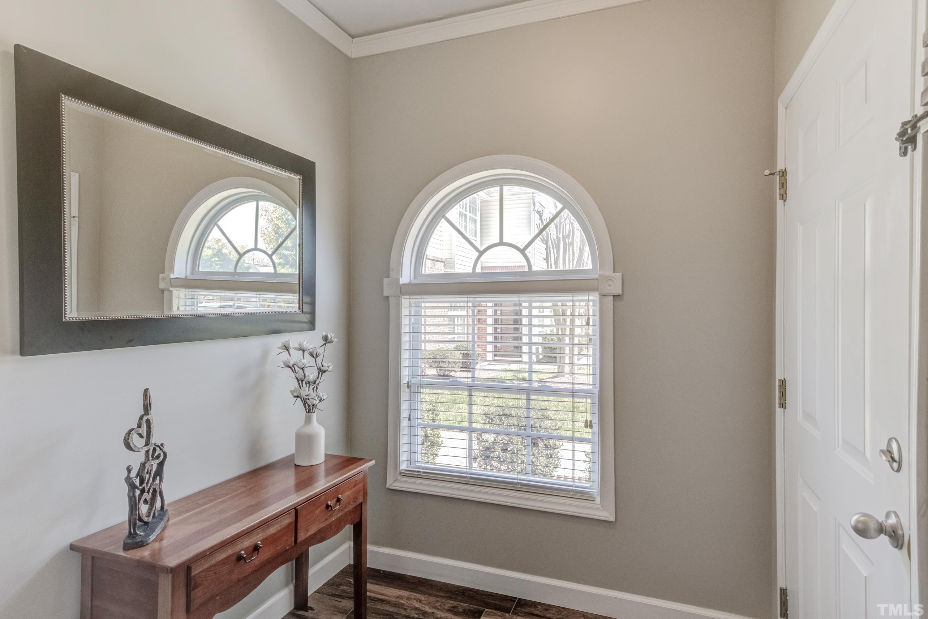 2101 Piney Brook Road, Unit 107 Raleigh, NC 27614 - Photo 3 of 37 a view of room with a window and wooden floor
