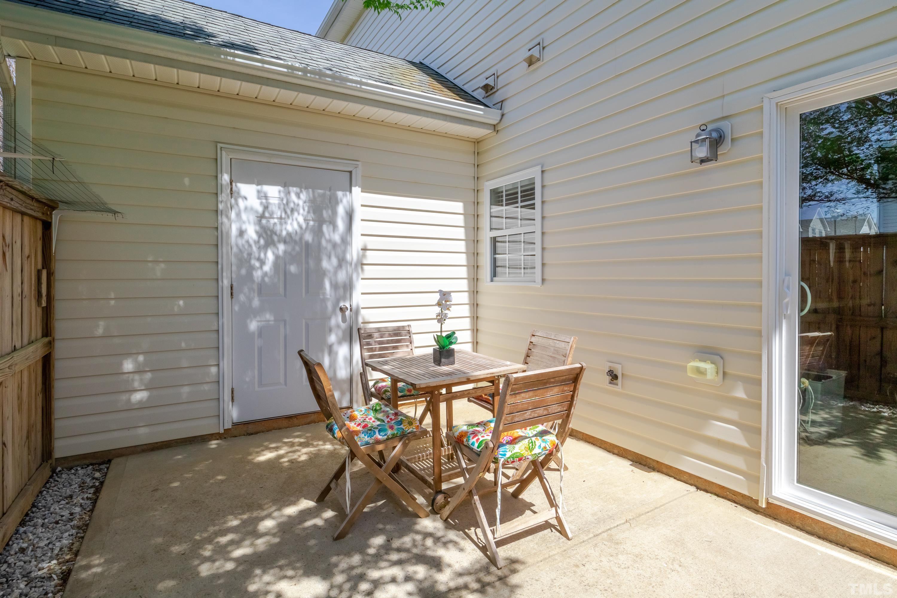 2101 Piney Brook Road, Unit 107 Raleigh, NC 27614 - Photo 33 of 37 a view of a outdoor space with a table and chairs and barbeque