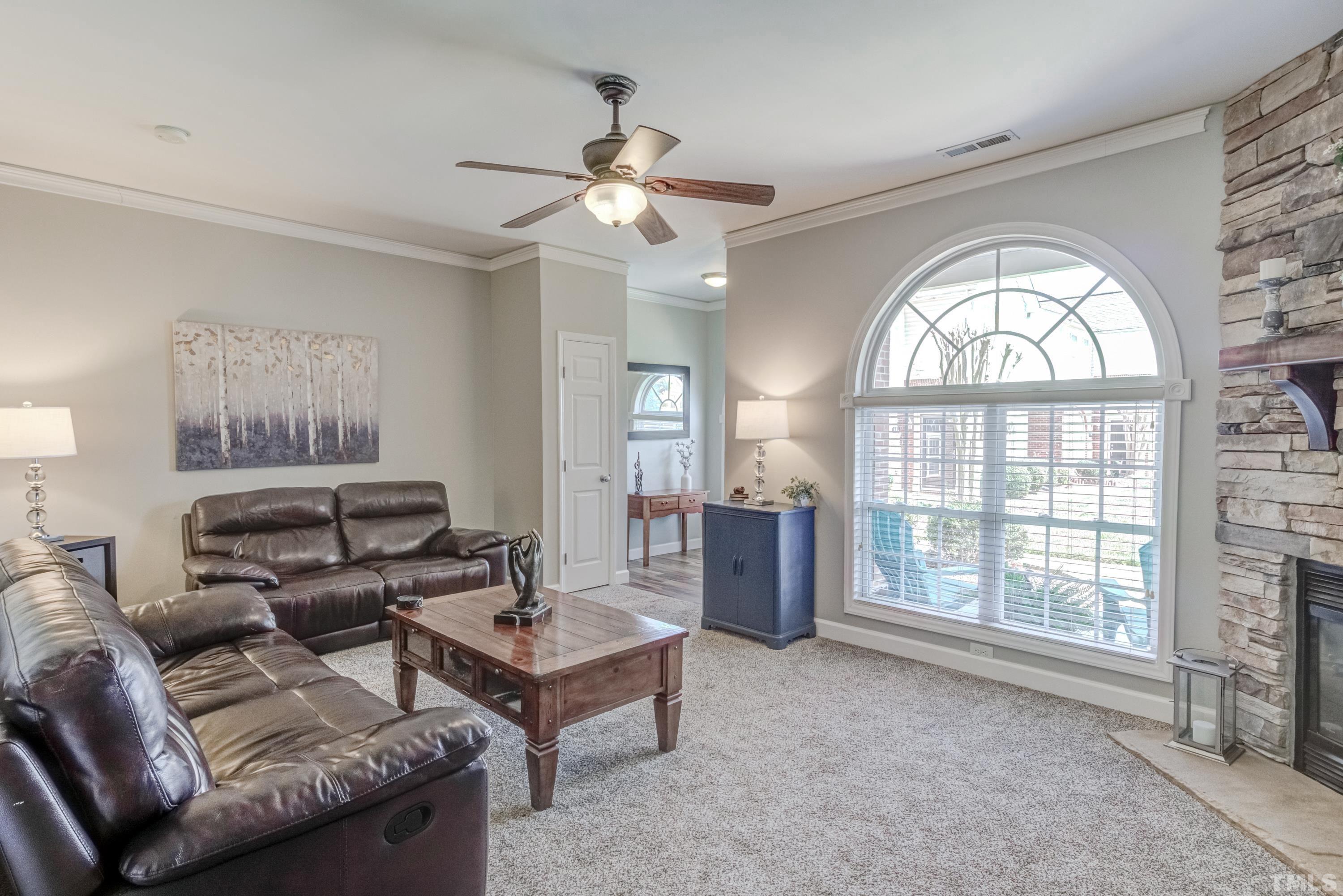 2101 Piney Brook Road, Unit 107 Raleigh, NC 27614 - Photo 8 of 37 a living room with furniture and a window