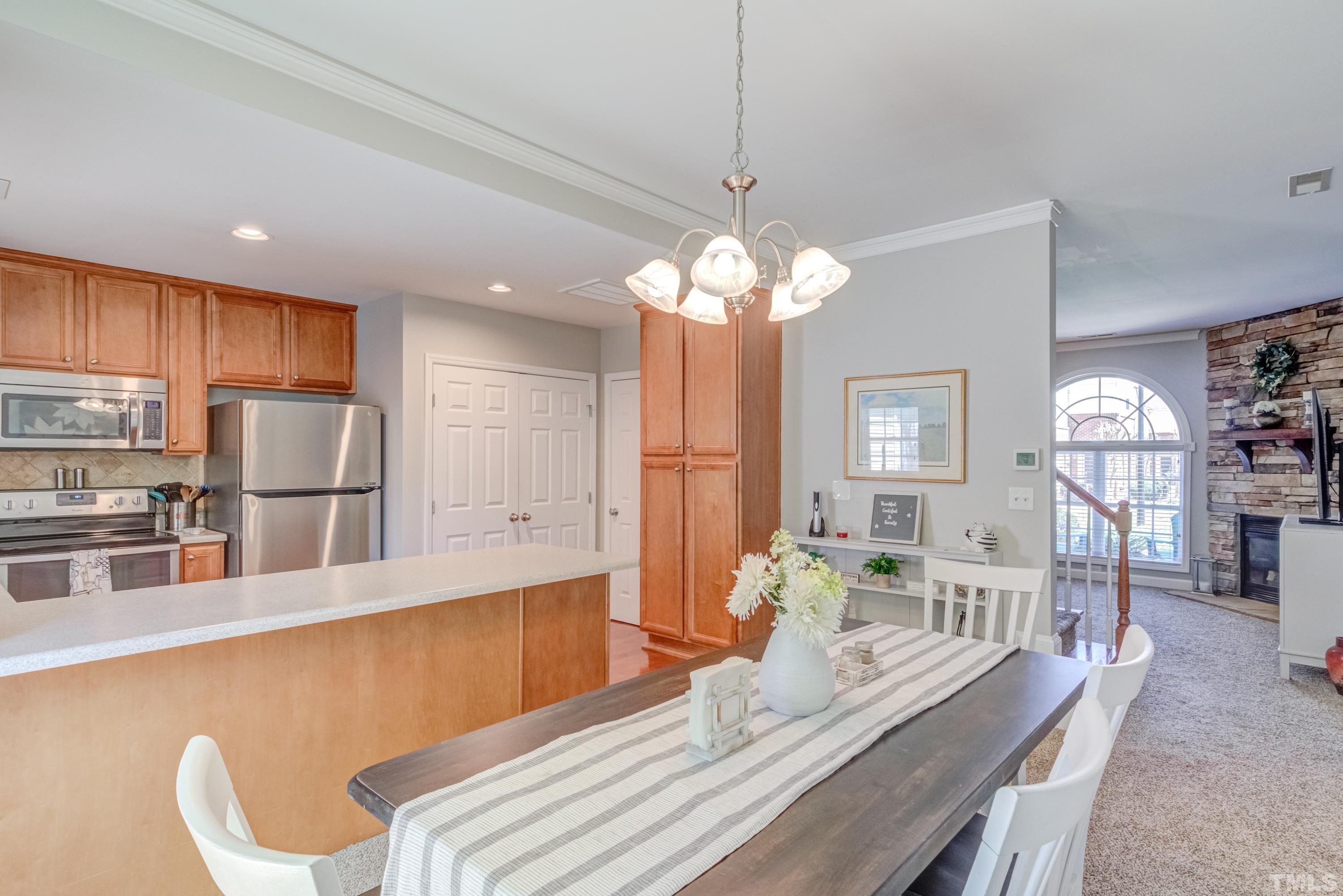 2101 Piney Brook Road, Unit 107 Raleigh, NC 27614 - Photo 10 of 37 a large kitchen with a table and chairs