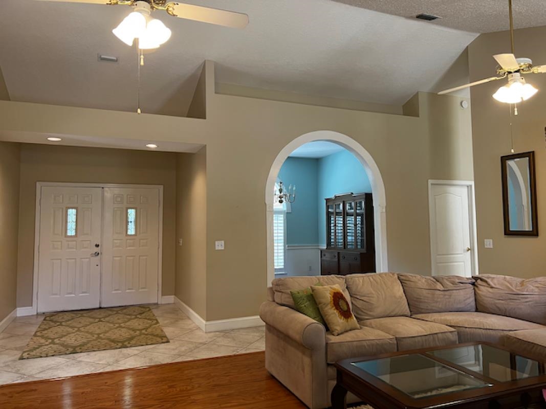 3260 Turtle Creek Road St. Augustine, FL 32086 - Photo 18 of 20 a living room with furniture and a mirror