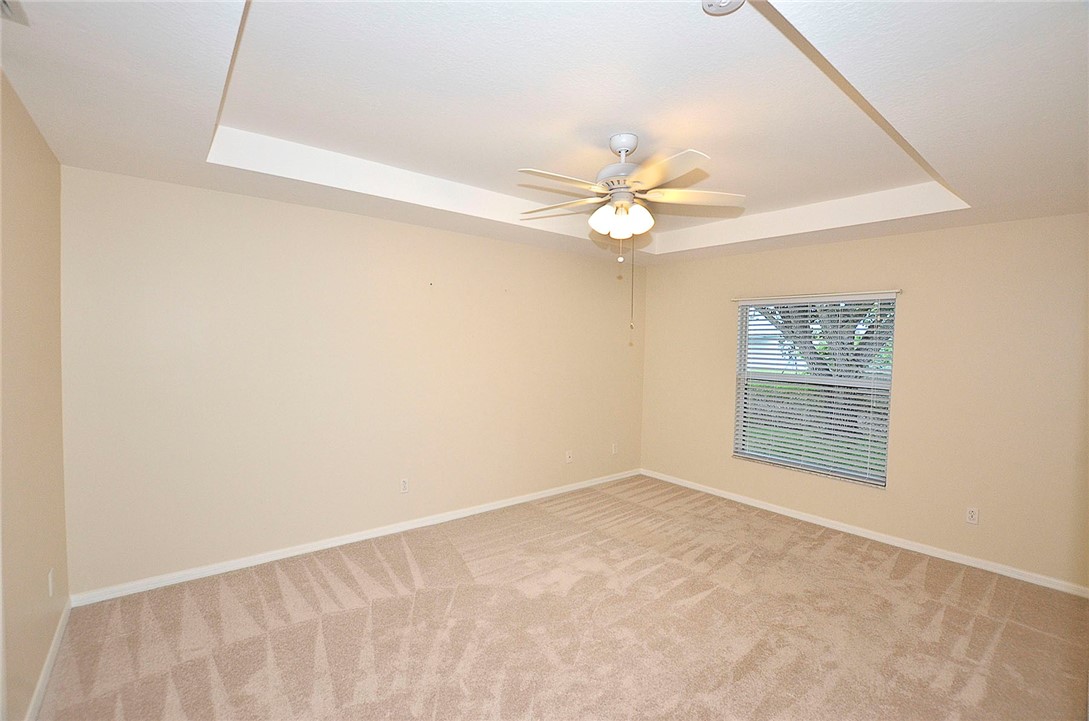 1210 Clearmont Street Sebastian, FL 32958 - Photo 13 of 31 an empty room with a window and a ceiling fan