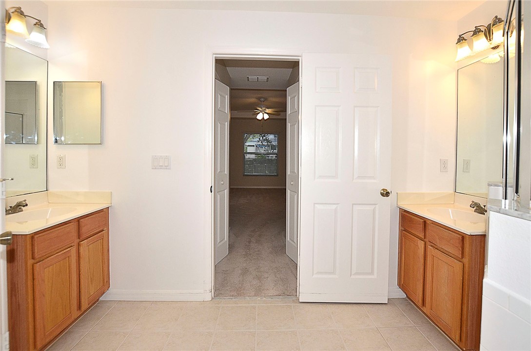 1210 Clearmont Street Sebastian, FL 32958 - Photo 15 of 31 a bathroom with a double vanity sink and mirror