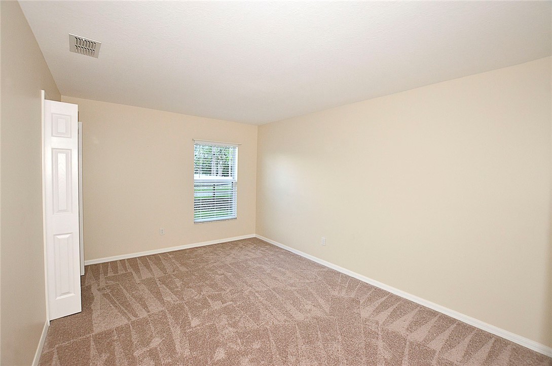 1210 Clearmont Street Sebastian, FL 32958 - Photo 20 of 31 a view of an empty room with a window