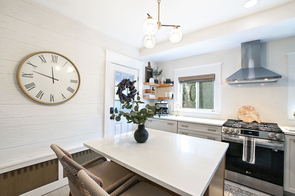 265 Maple Street New Bedford, MA 02740 - Photo 11 of 35 a view of a dining room with furniture and a chandelier