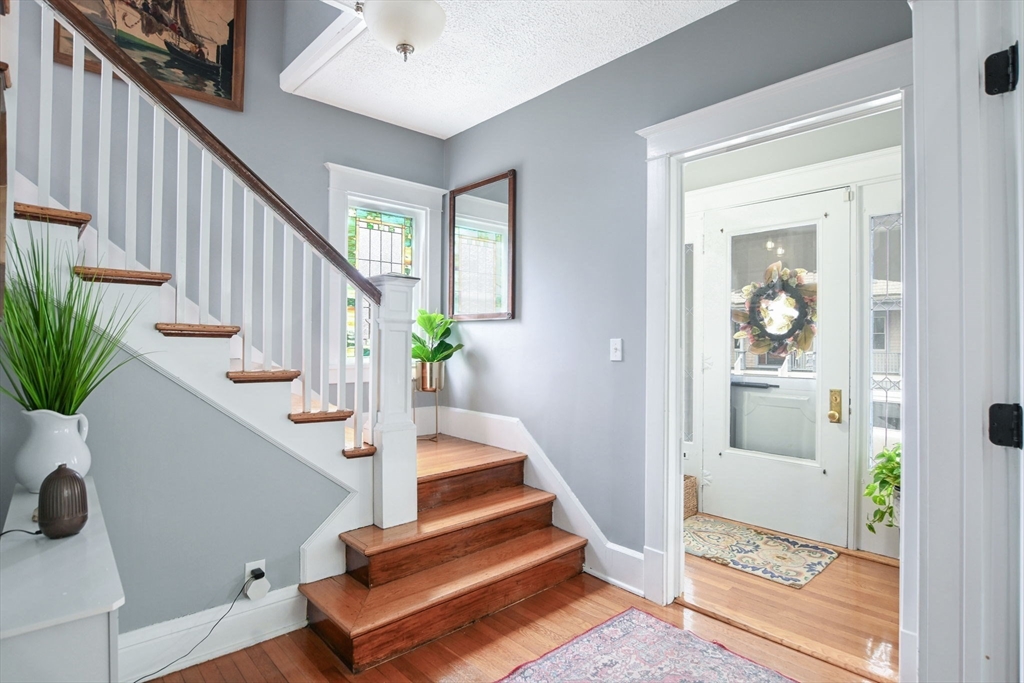 265 Maple Street New Bedford, MA 02740 - Photo 2 of 35 a view of entryway and hall with wooden floor