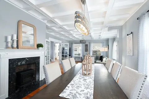a living room with furniture wooden floor and a fireplace