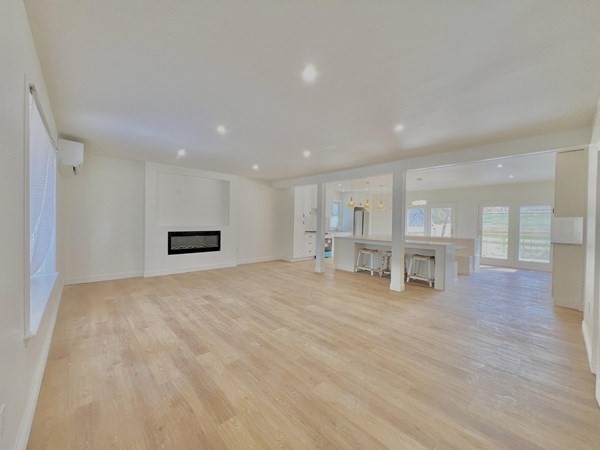 31 Carleton Street Attleboro, MA 02703 - Photo 5 of 14 a view of empty room with kitchen and sink