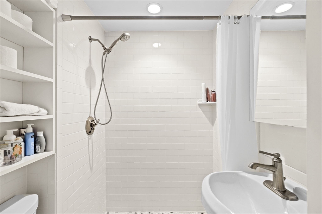 362 Commonwealth Avenue, Unit 2H Boston, MA 02115 - Photo 11 of 20 a bathroom with a sink and a mirror