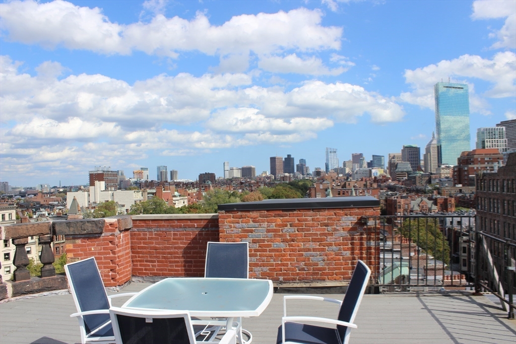 362 Commonwealth Avenue, Unit 2H Boston, MA 02115 - Photo 19 of 20 a view of a chairs and table in the terrace