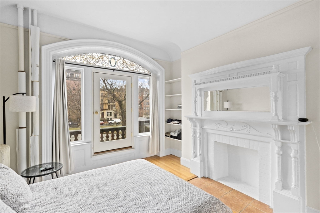 362 Commonwealth Avenue, Unit 2H Boston, MA 02115 - Photo 7 of 20 a view of a livingroom with wooden floor and a fireplace